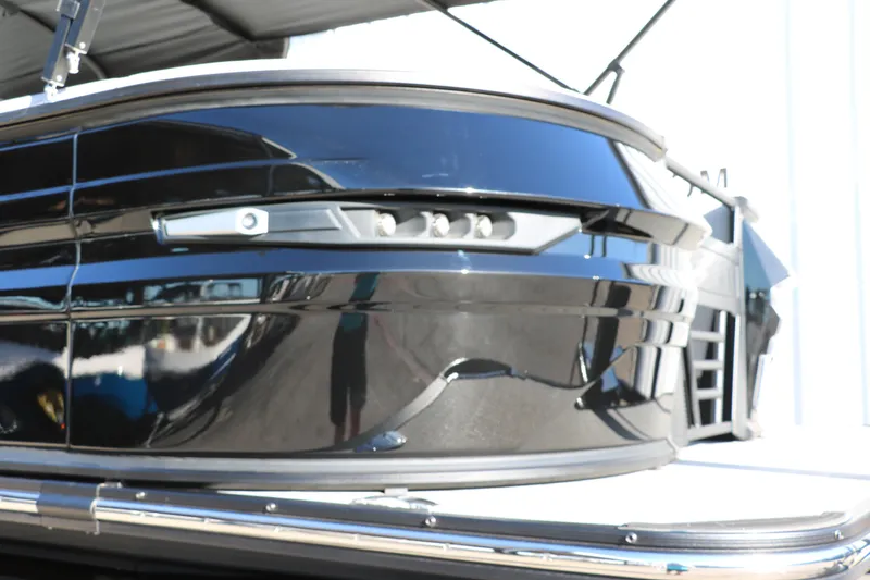 Slide: The Image of 2025 Sylvan G3 CLZ DH boat, sleek black exterior, modern design. - 14