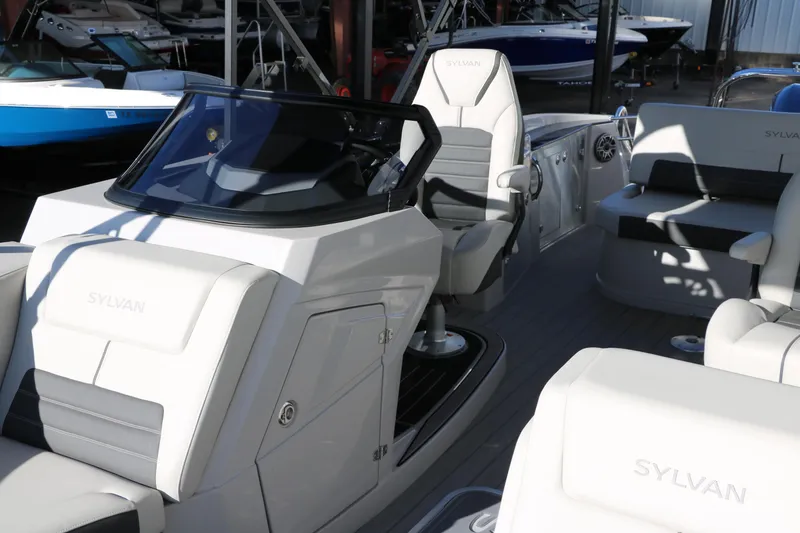 Slide: The Image of 2025 Sylvan G3 CLZ DH boat interior with sleek seating and modern dashboard design. - 19