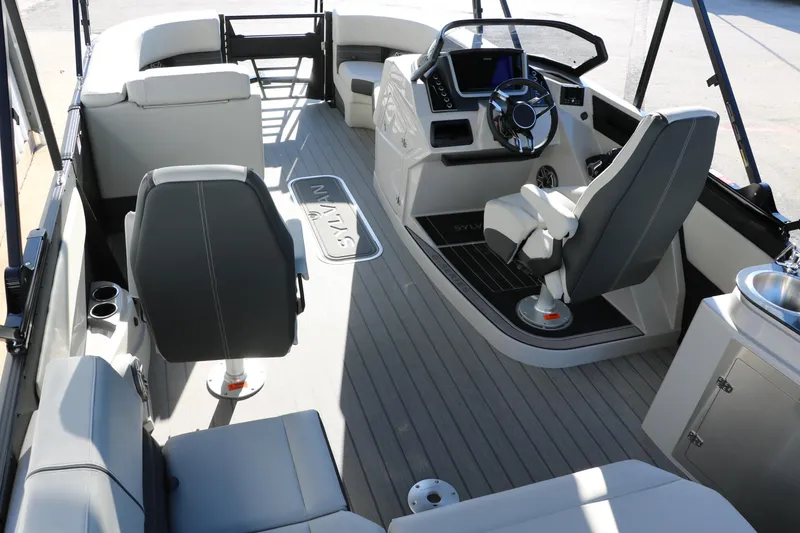 Slide: The Image of Interior of 2025 Sylvan G3 CLZ DH boat with modern seating and steering console. - 22