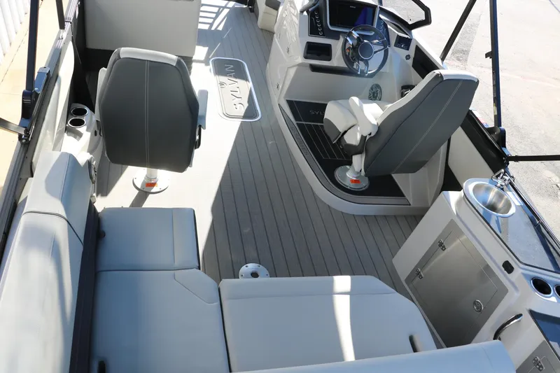 Slide: The Image of Interior of 2025 Sylvan G3 CLZ DH boat with modern seating and steering console. - 23