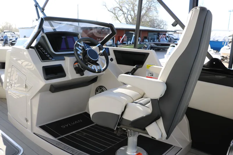 Slide: The Image of 2025 Sylvan G3 CLZ DH boat helm with modern steering and comfortable captain's chair. - 25