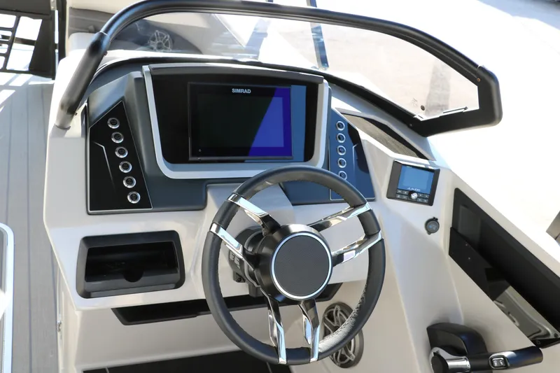 Slide: The Image of 2025 Sylvan G3 CLZ DH boat dashboard with modern steering and digital display. - 31