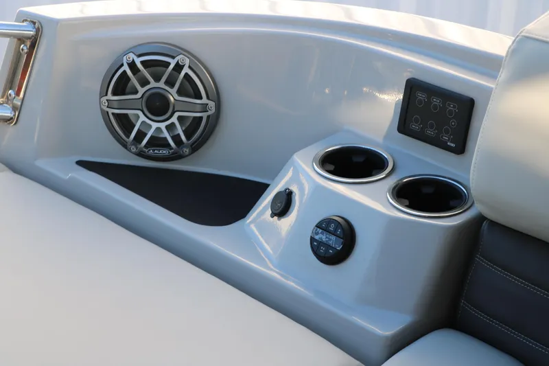Slide: The Image of Interior of 2025 Sylvan G3 CLZ DH boat with speaker, cup holders, and control panel. - 35