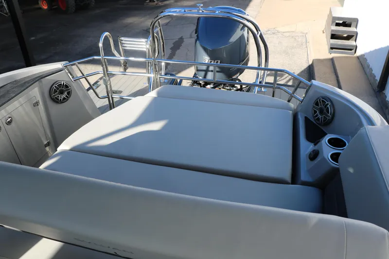 Slide: The Image of 2025 Sylvan G3 CLZ DH boat interior with seating, speakers, and engine view. - 36