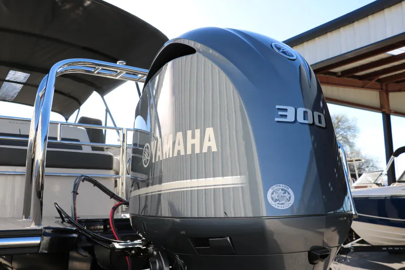 Slide: The Image of 2025 Sylvan G3 CLZ DH boat with Yamaha 300 outboard motor in a marina setting. - 6