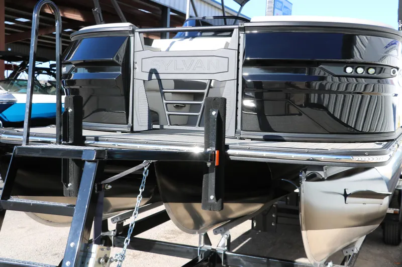 Slide: The Image of 2025 Sylvan G3 CLZ DH pontoon boat on trailer, showcasing sleek design and modern features. - 8