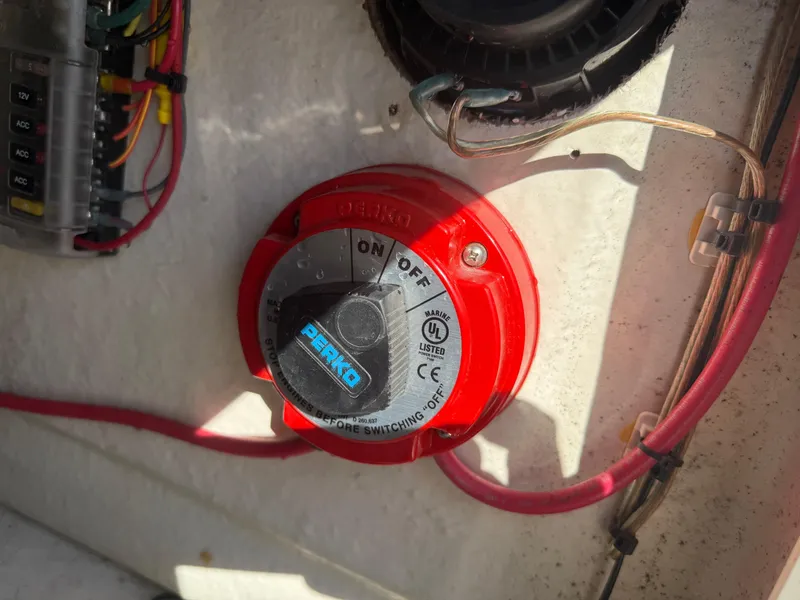 Slide: The Image of Red battery switch on 2023 Key West 1720 Center Console boat. - 21