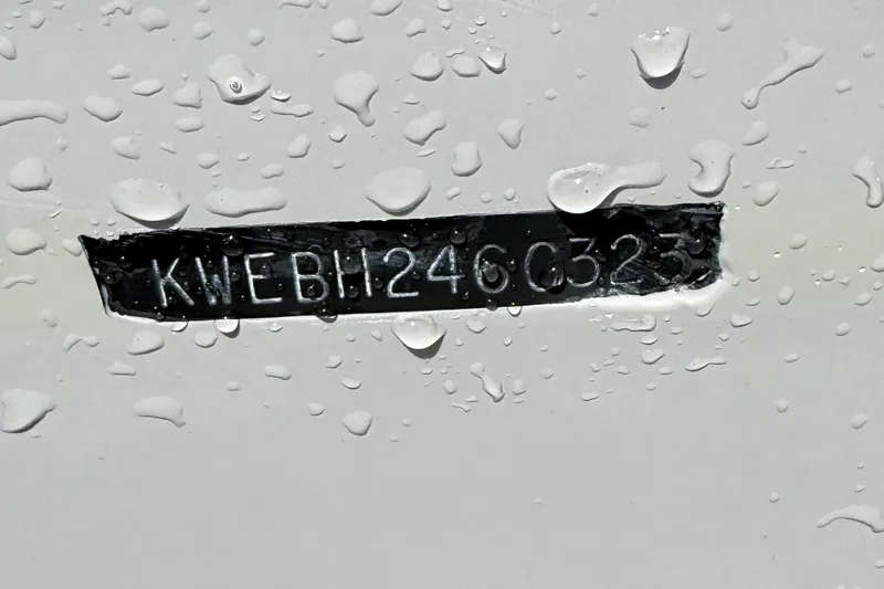 Slide: The Image of 2023 Key West 1720 Center Console boat hull identification number with water droplets. - 23