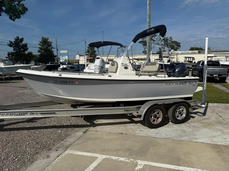 Slide: The Image of 2023 Key West 1720 Center Console boat on trailer in parking lot. - 5