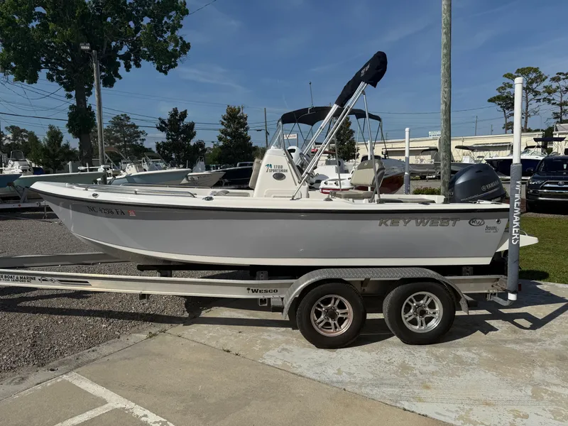 Slide: The Image of 2023 Key West 1720 Center Console boat on trailer in outdoor setting. - 6