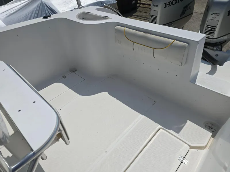 Slide: The Image of 2005 Sea Chaser 2600 Offshore boat interior with clean deck and Honda outboard engines. - 10