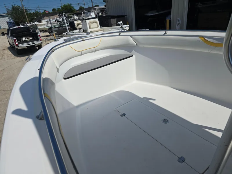 Slide: The Image of 2005 Sea Chaser 2600 Offshore boat interior with seating and storage compartments. - 13