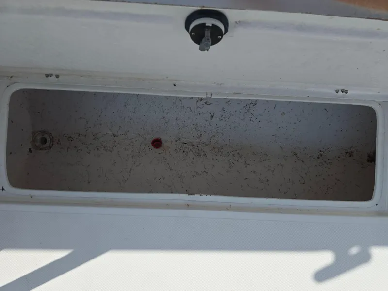Slide: The Image of Open storage compartment on a 2005 Sea Chaser 2600 Offshore boat. - 15