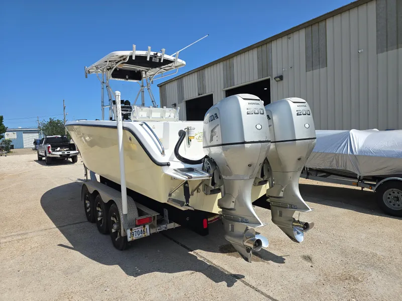 Slide: The Image of 2005 Sea Chaser 2600 Offshore boat with dual engines on a trailer. - 5