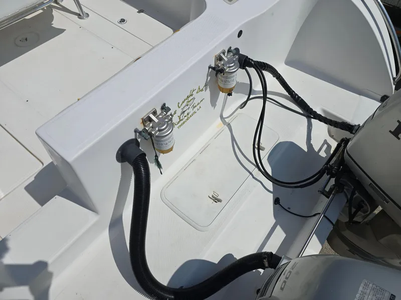 Slide: The Image of 2005 Sea Chaser 2600 Offshore boat engine compartment with fuel filters and wiring. - 8