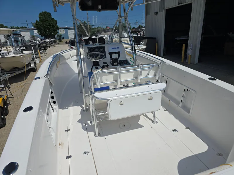 Slide: The Image of 2005 Sea Chaser 2600 Offshore boat interior with helm and seating area. - 9