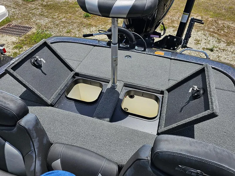 Slide: The Image of 2022 Skeeter ZX200 boat with open storage compartments and seating. - 11
