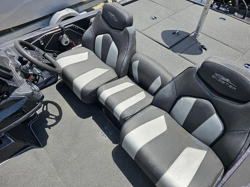 Slide: The Image of 2022 Skeeter ZX200 boat interior with black and gray seating. - 12