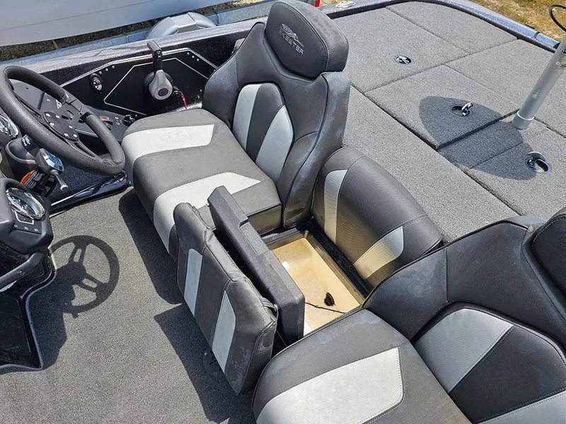 Slide: The Image of 2022 Skeeter ZX200 boat interior with gray and black seating and storage compartment. - 13