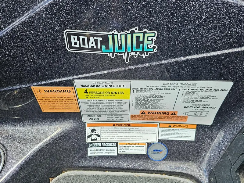 Slide: The Image of 2022 Skeeter ZX200 boat warning labels and capacity information with "Boat Juice" sticker. - 16