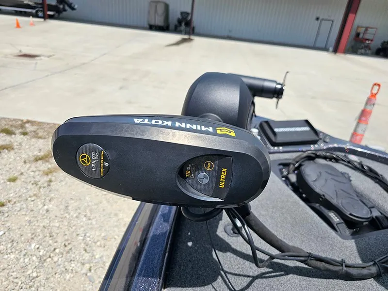 Slide: The Image of 2022 Skeeter ZX200 boat with Minn Kota Ultrex trolling motor in a parking area. - 20