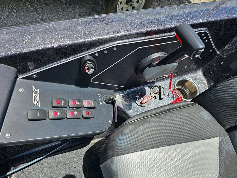 Slide: The Image of 2022 Skeeter ZX200 boat console with control panel and steering wheel. - 21