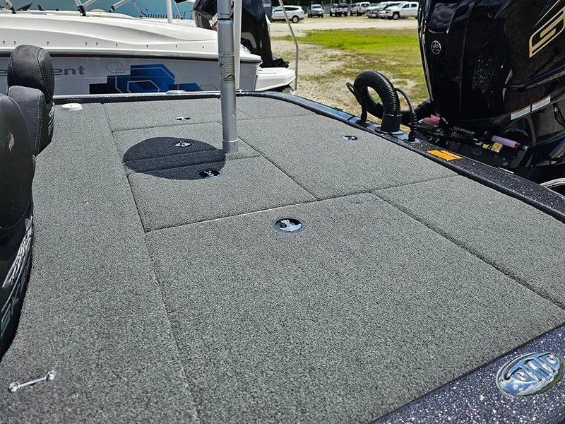 Slide: The Image of 2022 Skeeter ZX200 boat deck with carpeted surface and storage compartments. - 8