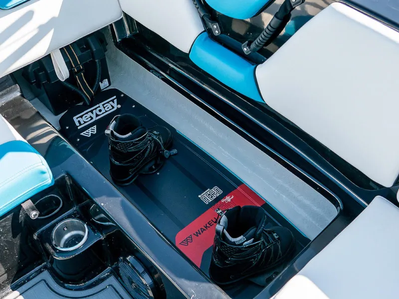 Slide: The Image of Interior of 2025 HEYDAY WAKE BOATS WT-SURF with wakeboard and boots. - 12
