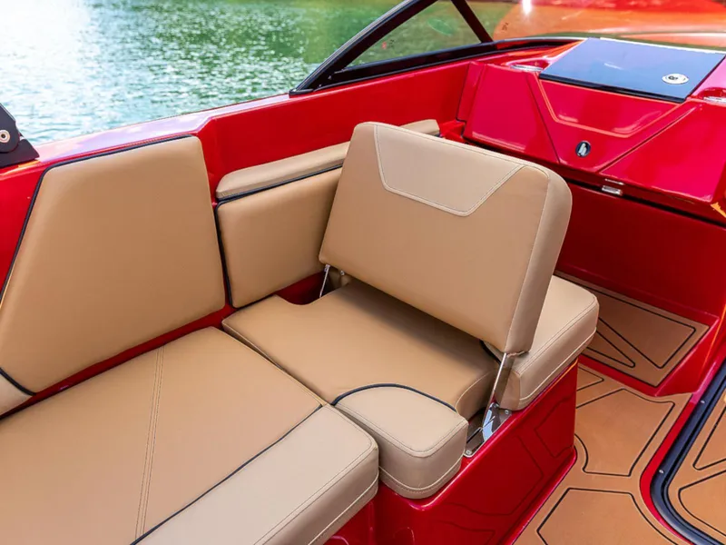 Slide: The Image of 2025 HEYDAY WAKE BOATS WT-SURF interior with tan seating and red accents. - 13