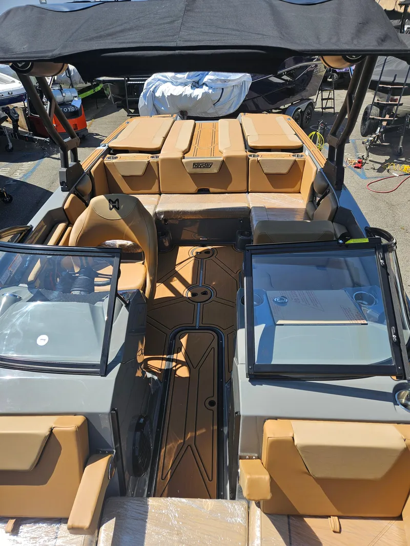 Slide: The Image of 2025 HEYDAY WAKE BOATS WT-SURF interior with tan seating and sleek design. - 3