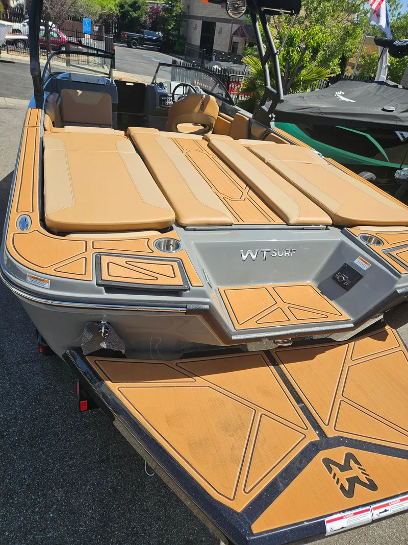 Slide: The Image of 2025 HEYDAY WAKE BOATS WT-SURF with tan seating and sleek design. - 6