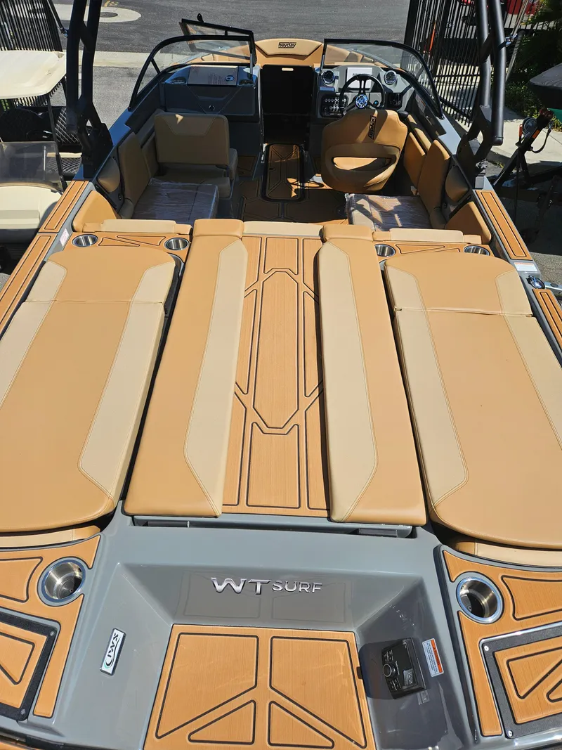 Slide: The Image of 2025 HEYDAY WAKE BOATS WT-SURF interior with tan seating and sleek design. - 7