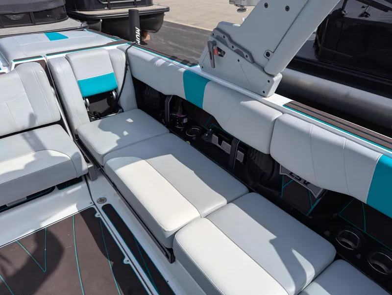 Slide: The Image of 2022 Malibu Wakesetter 23 LSV interior with white and teal seating, showcasing luxury design. - 13