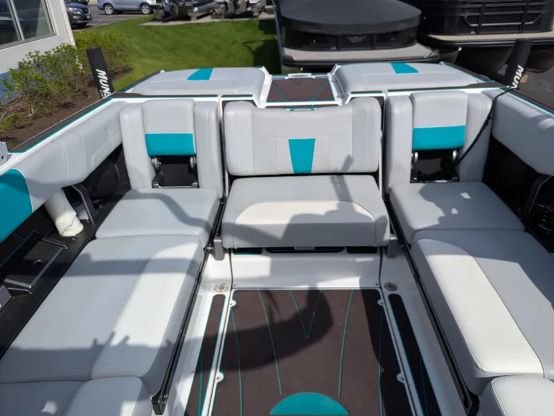 Slide: The Image of 2022 Malibu Wakesetter 23 LSV interior with gray and teal seating. - 14