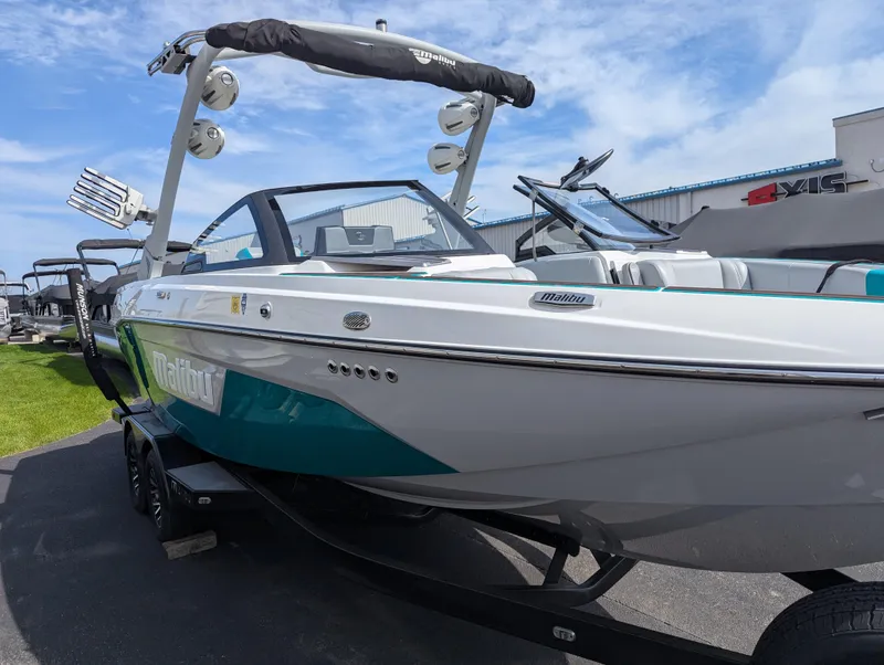 Slide: The Image of 2022 Malibu Wakesetter 23 LSV boat with sleek design and vibrant colors on a trailer. - 6