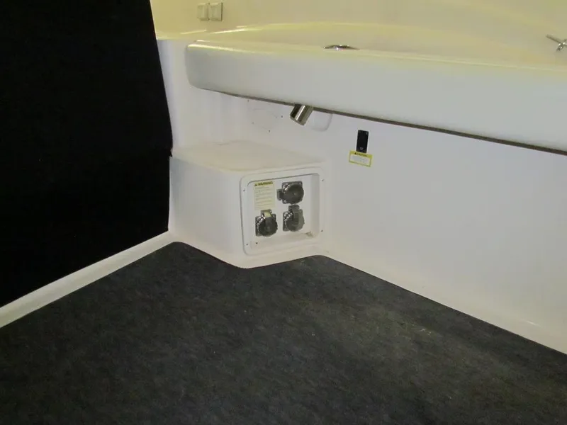 Slide: The Image of 1999 Tiara Yachts 3500 Open interior with electrical panel and seating area. - 13