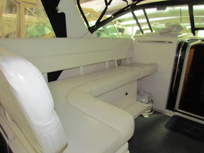 Slide: The Image of Interior of 1999 Tiara Yachts 3500 Open with white leather seating. - 19