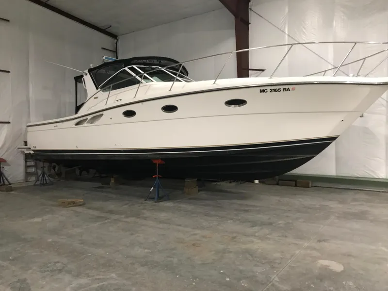 Slide: The Image of 1999 Tiara Yachts 3500 Open boat in indoor storage on stands. - 2