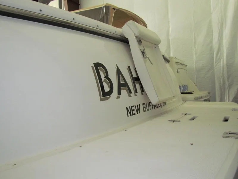 Slide: The Image of 1999 Tiara Yachts 3500 Open, docked in New Buffalo, MI, with visible name "BAH". - 21
