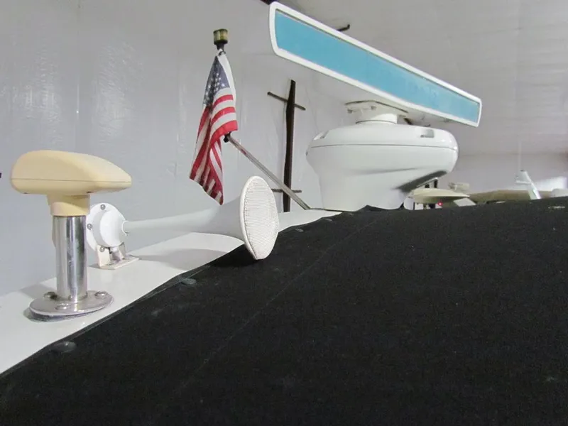 Slide: The Image of 1999 Tiara Yachts 3500 Open with radar and American flag in a storage facility. - 28