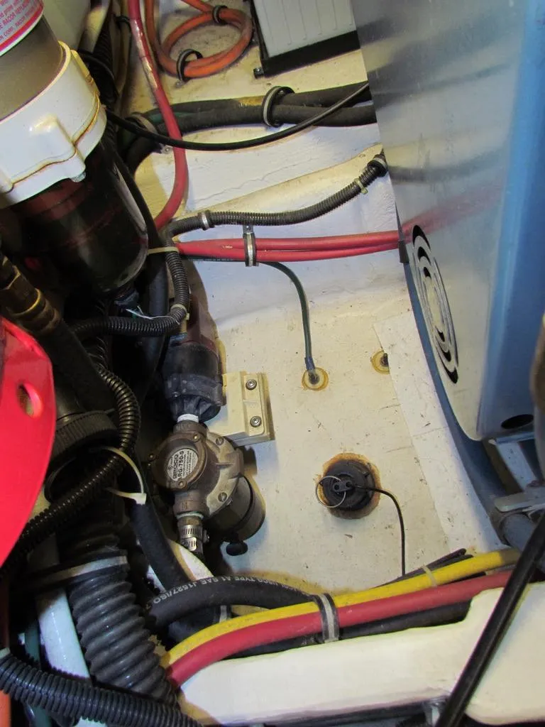 Slide: The Image of Engine compartment of a 1999 Tiara Yachts 3500 Open, showing wiring and components. - 36