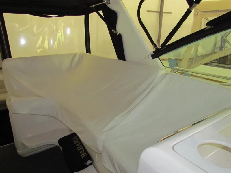 Slide: The Image of 1999 Tiara Yachts 3500 Open interior with covered seating area. - 7