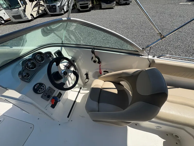 Slide: The Image of 2017 NauticStar 203 DC boat interior with steering wheel and dashboard controls. - 14