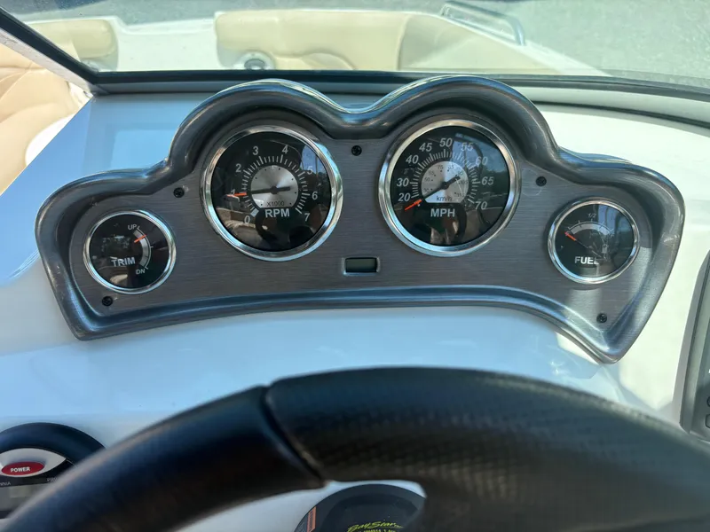 Slide: The Image of Dashboard of 2017 NauticStar 203 DC boat with RPM, MPH, and fuel gauges. - 15