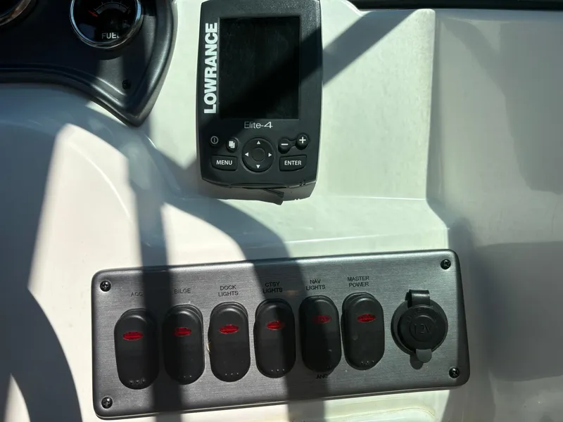 Slide: The Image of Control panel of 2017 NauticStar 203 DC boat with Lowrance Elite-4 device. - 16