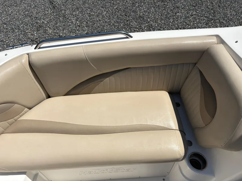 Slide: The Image of 2017 NauticStar 203 DC boat with beige leather seating. - 24