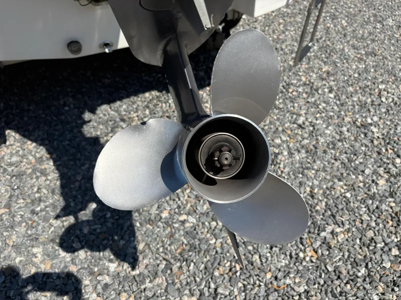 Slide: The Image of Propeller of 2017 NauticStar 203 DC boat on gravel surface. - 4