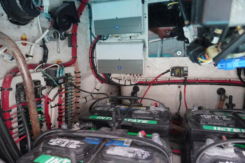 Slide: The Image of Electrical system of a 1994 Wellcraft 30 Scarab Sport boat with batteries and wiring. - 17