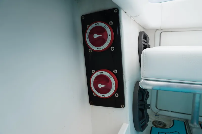 Slide: The Image of Battery switches on a 1994 Wellcraft 30 Scarab Sport boat interior. - 18