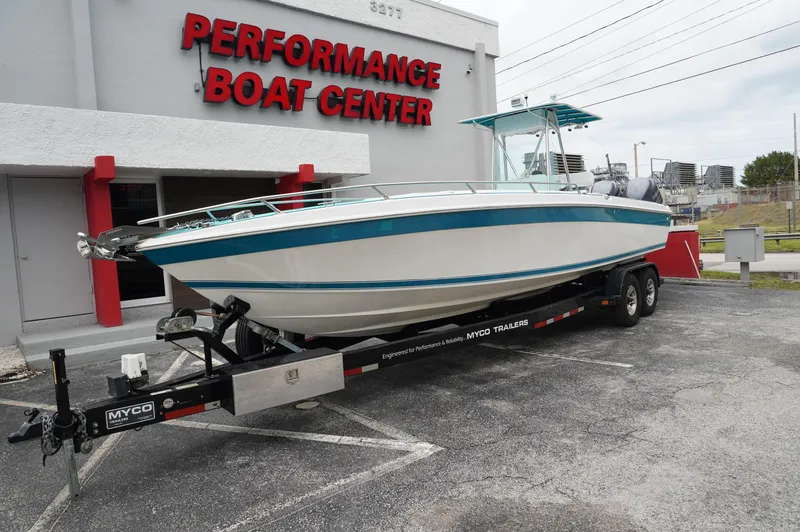 Slide: The Image of 1994 Wellcraft 30 Scarab Sport boat on trailer at Performance Boat Center. - 4